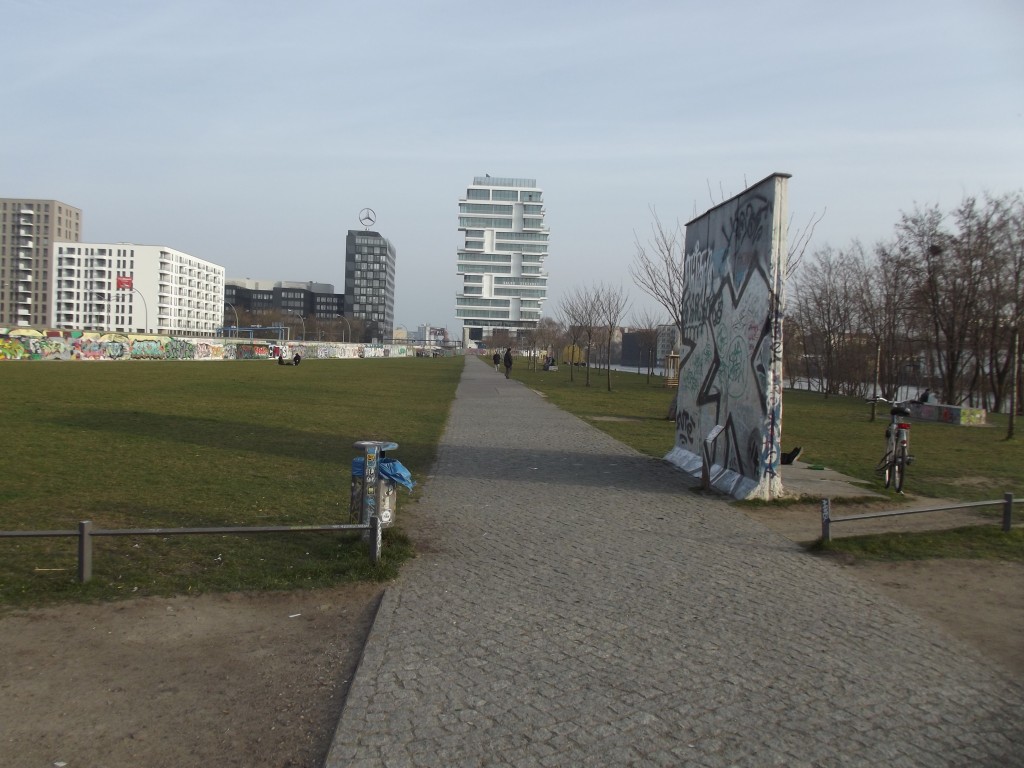 Park next to the Berlin Wall. The shoprt section of wall on the right shows a cross-section of it.