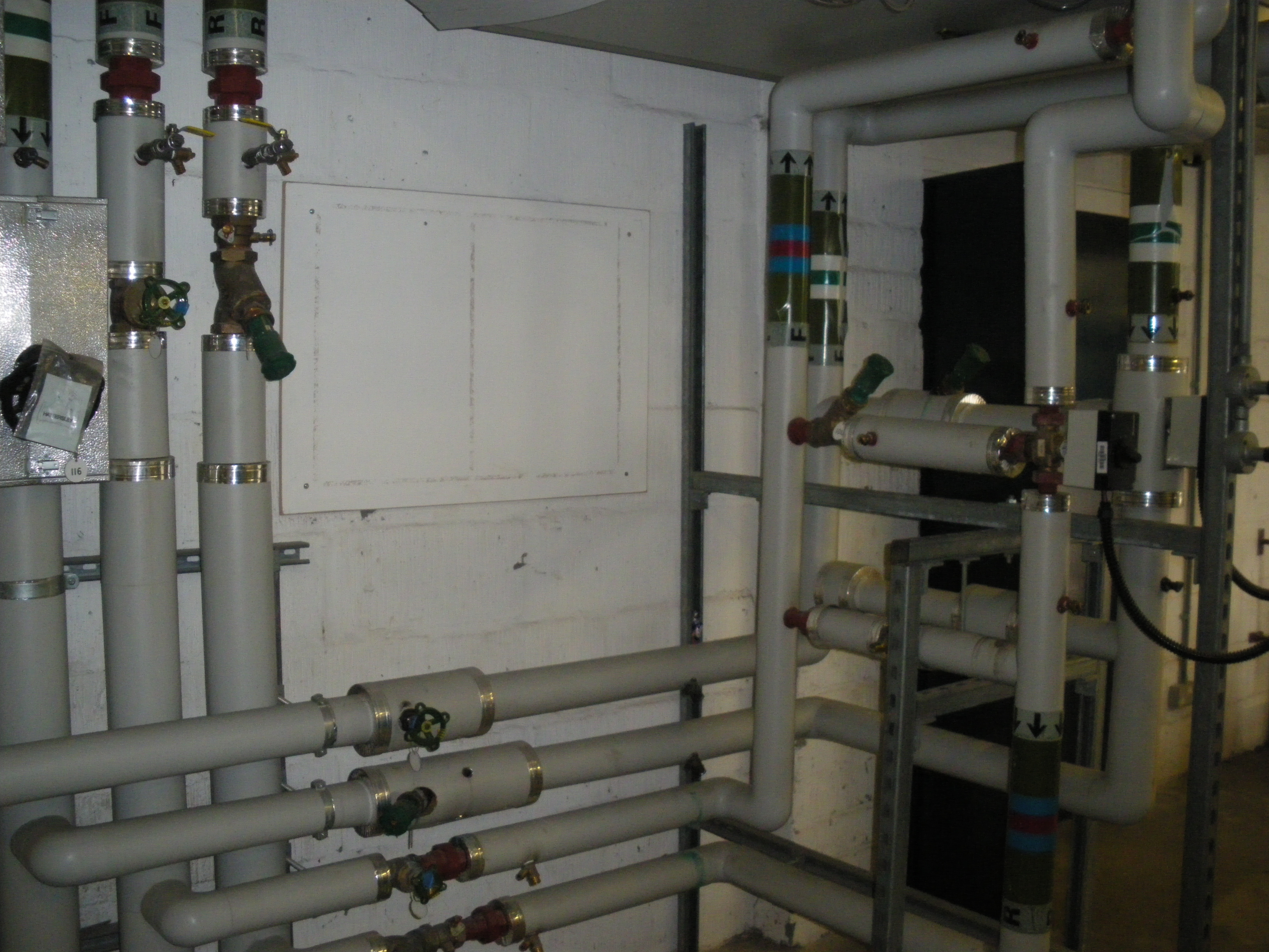 Pipes and valves for heating/chilled water in the Business Centre vent plant