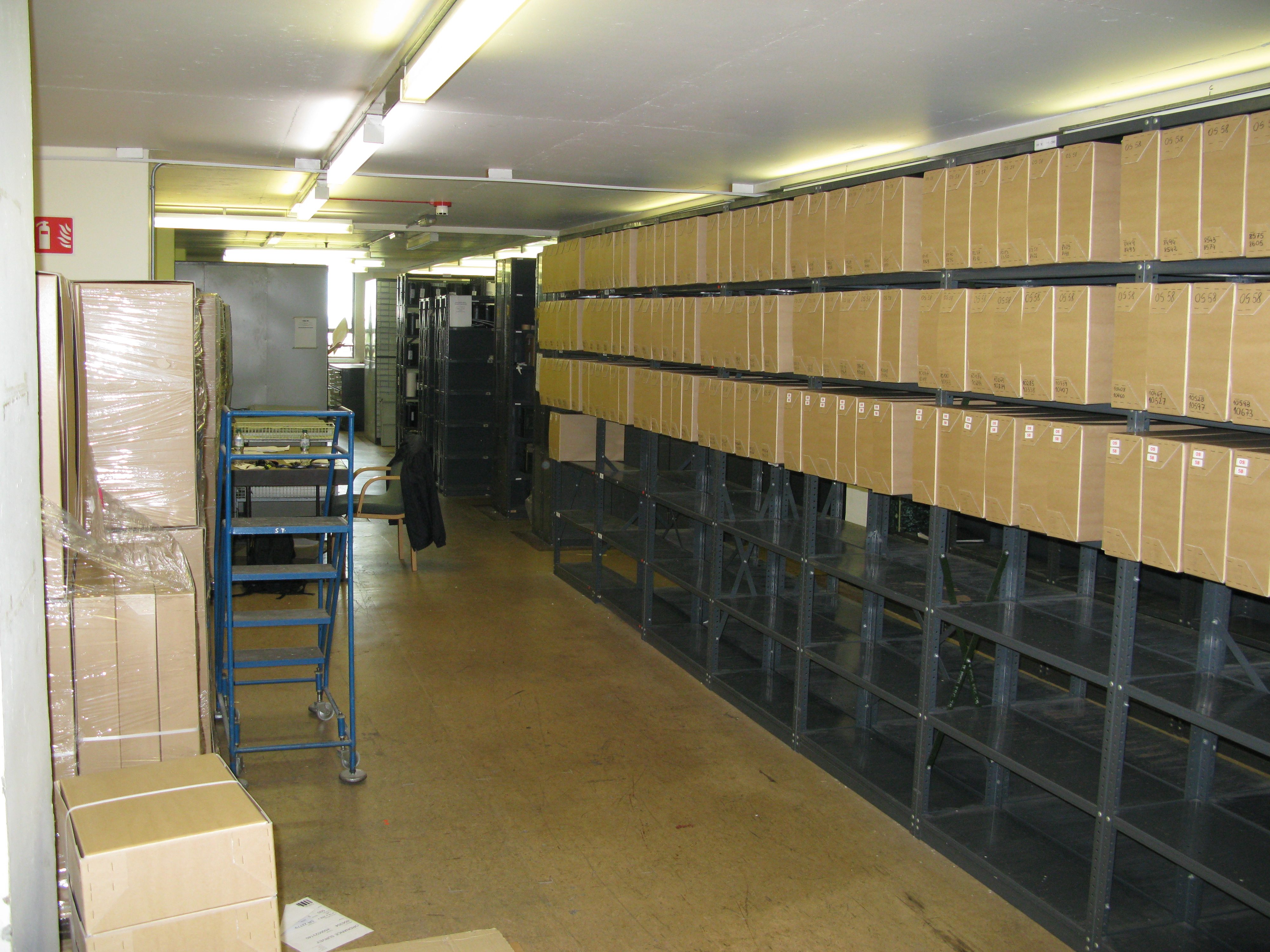 W301 - metal shelving holding cardboard boxes