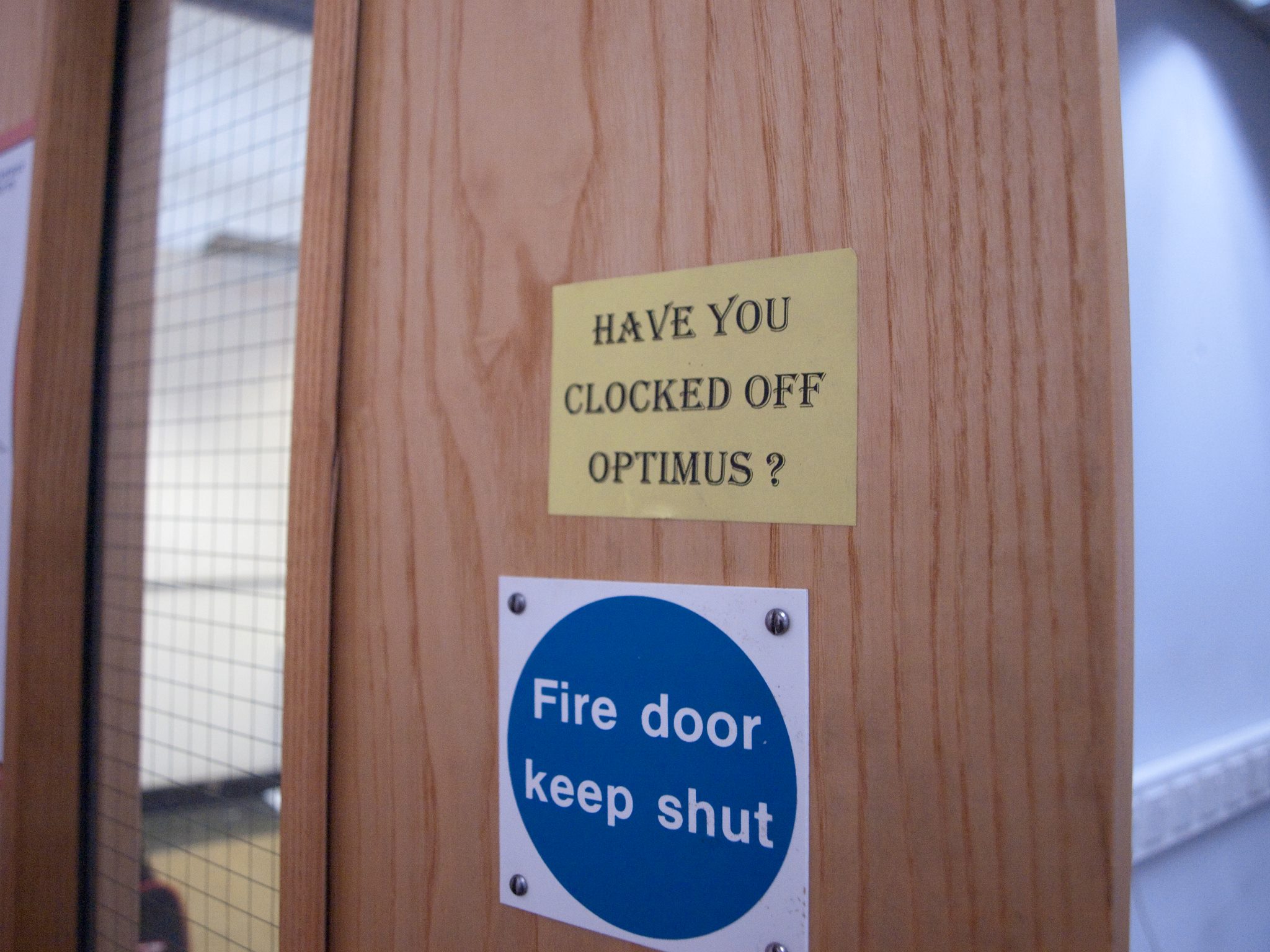 Door with reminder to clock off Optimus, 11 Sep 2011