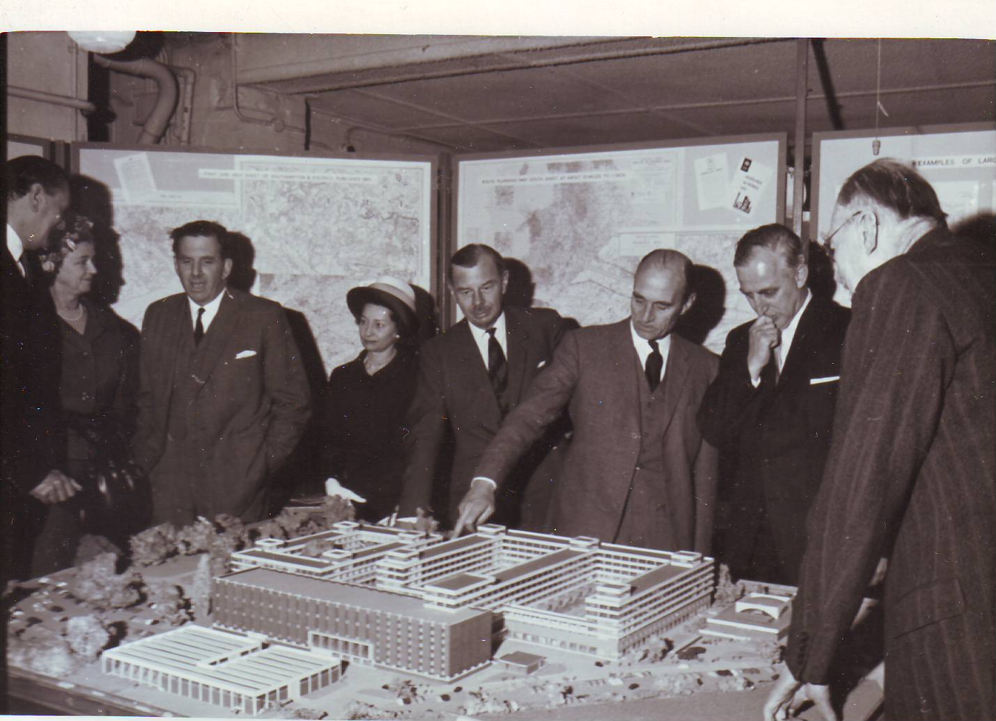 Dignitaries inspect a model of the new Maybush HQ